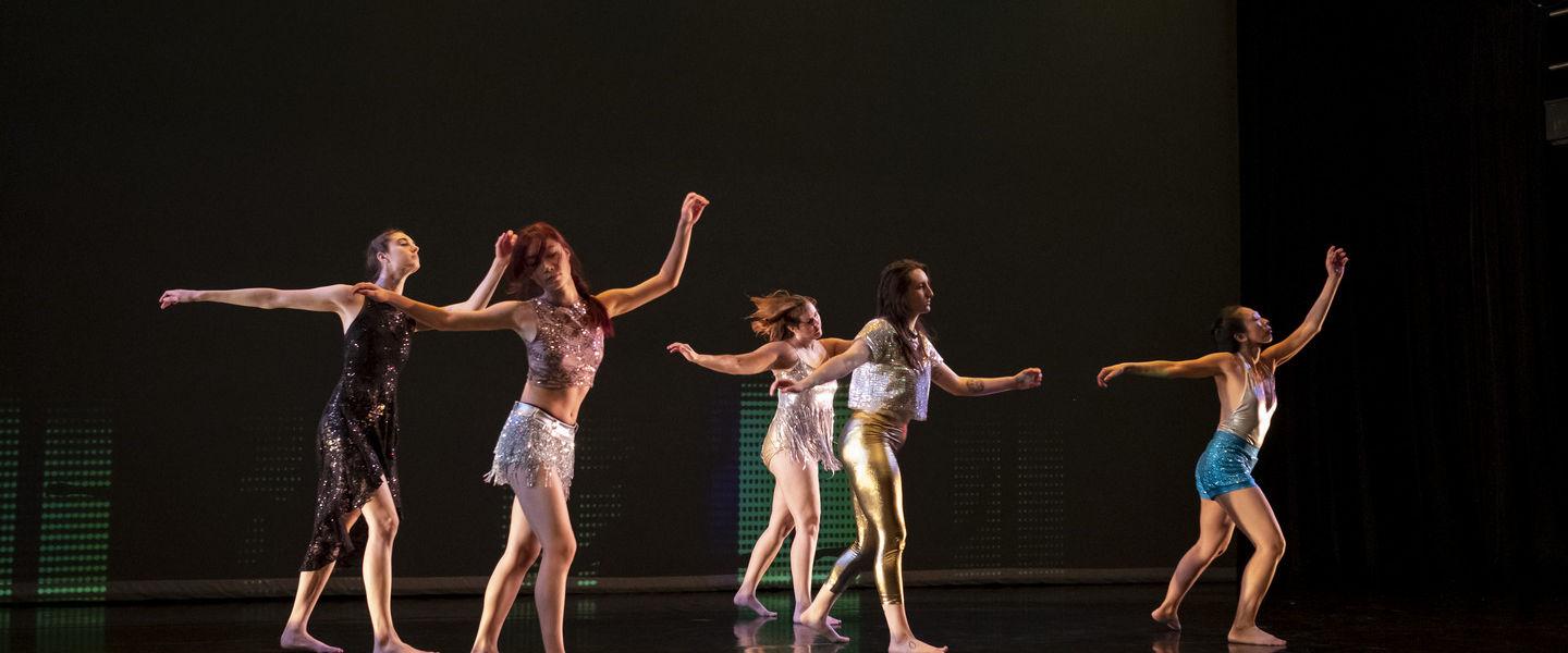 An image of four dancers on a stage during a Boyer dance recital. 